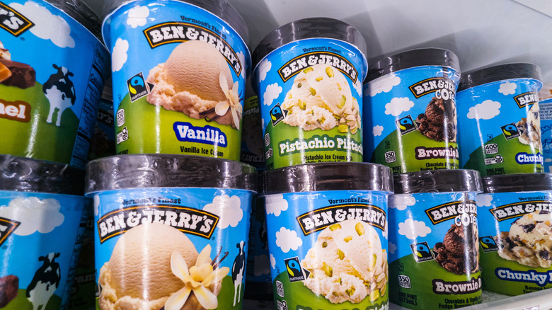 Pints of Ben & Jerry's ice cream in various flavors on display in store's freezer