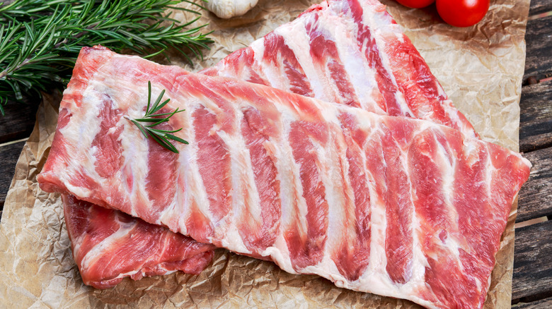 two racks of uncooked ribs