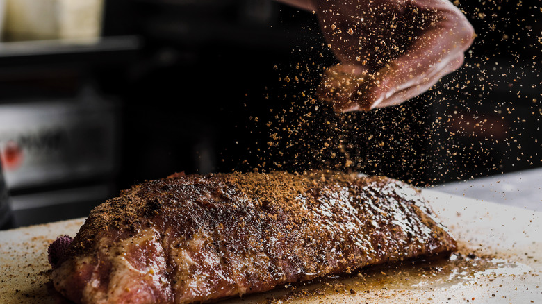 seasoning ribs with spices
