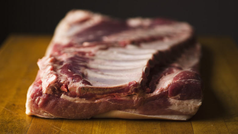 uncooked ribs on cutting board