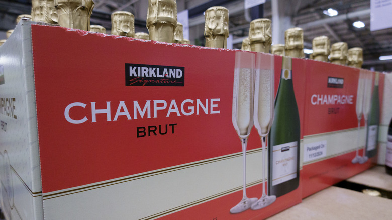 Boxes of champagne sit on pallets in a Costco