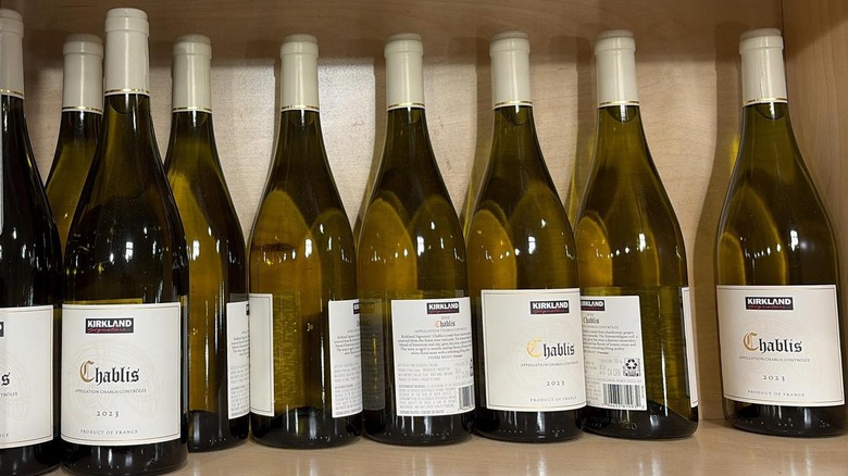 Bottles of Kirkland Signature Chablis sit on a shelf