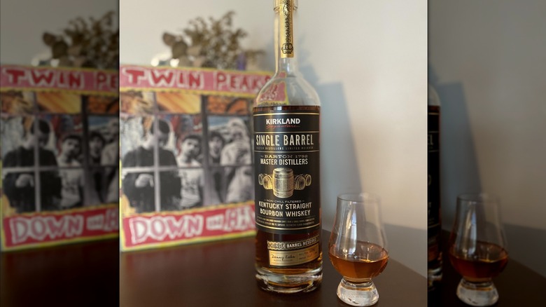 Kirkland Signature Single Barrel Straight Bourbon Whiskey and a glass of whiskey