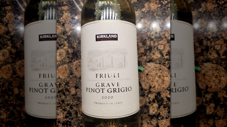 A bottle of Kirkland Signature Pinot Grigio Friuli rests on a counter