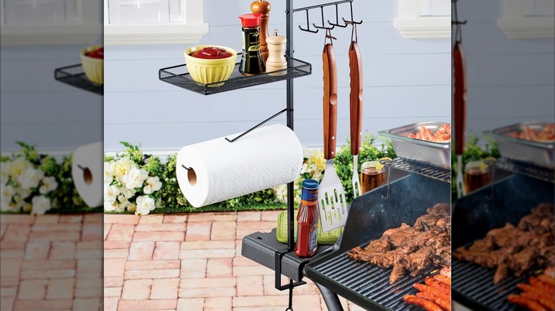 The metal accessory caddy attached to a grill