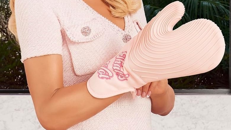 Paris Hilton wearing pink oven mitts
