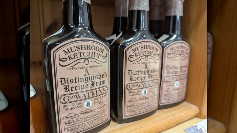 Bottles of Geo Watkins Mushroom Ketchup on a shelf