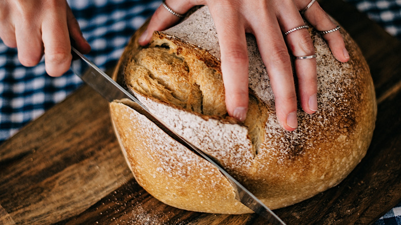 woman slicing bread