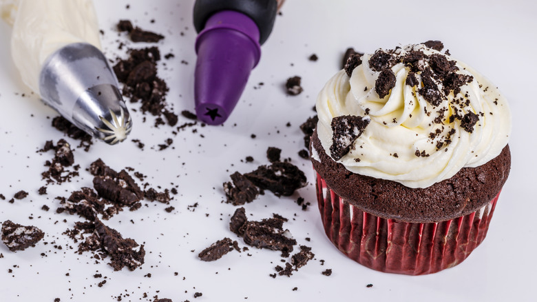 cupcake with frosting and cookie bits