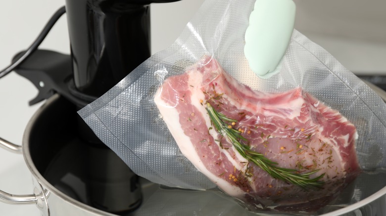 Putting vacuum sealed steak into sous vide