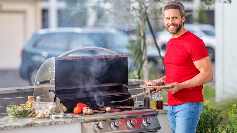 Man grilling food outdoors