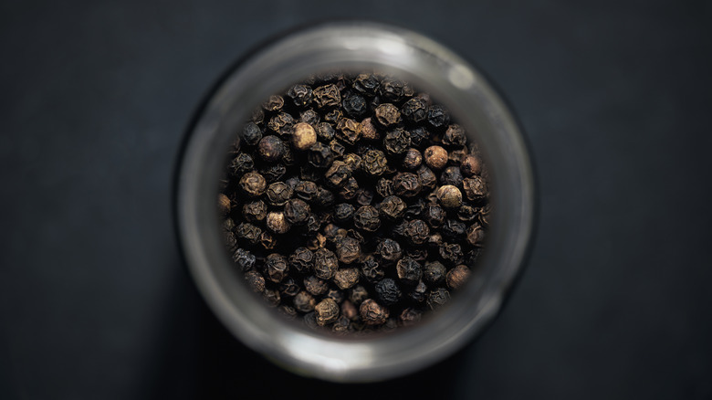 Black peppercorns in a bowl
