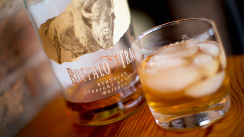 closeup of buffalo trace bottle and glass