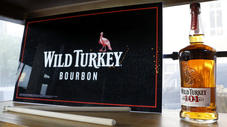 Wild turkey 101 bottle and sign