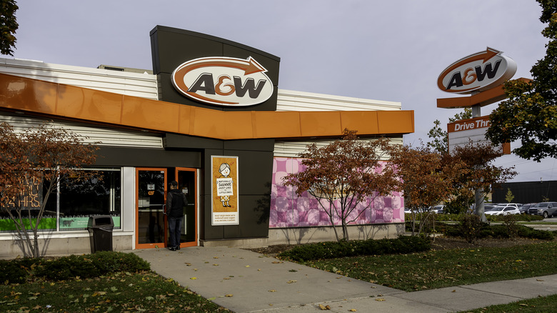 Exterior of an A&W restaurant as a customer enters