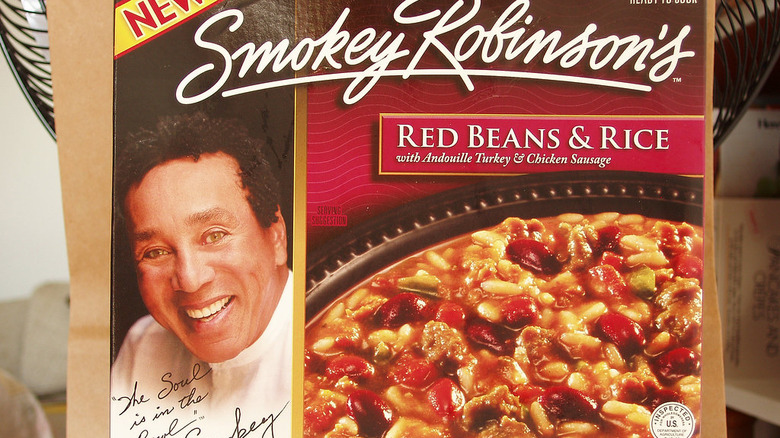 Smokey Robinson holding a microphone