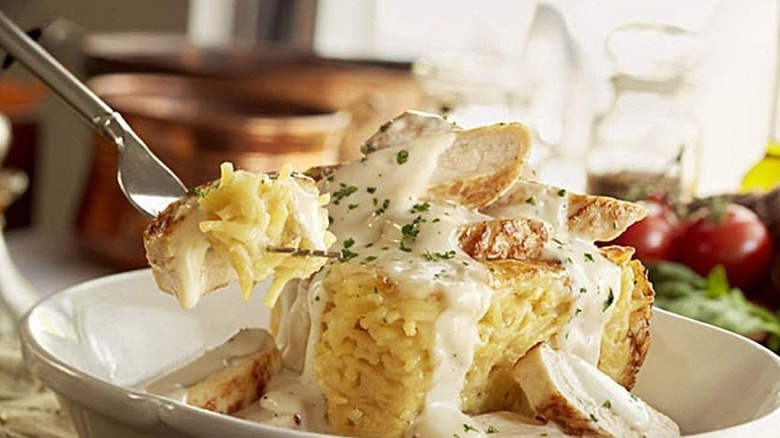 Cheesy baked spaghetti pie with slice cut out