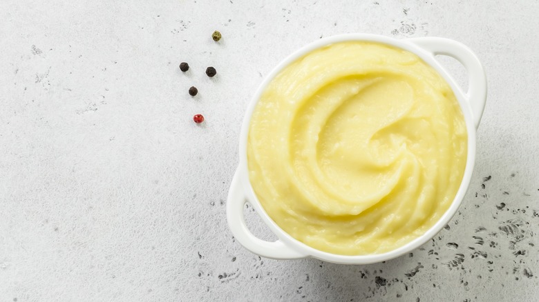 white bowl of mashed potatoes 