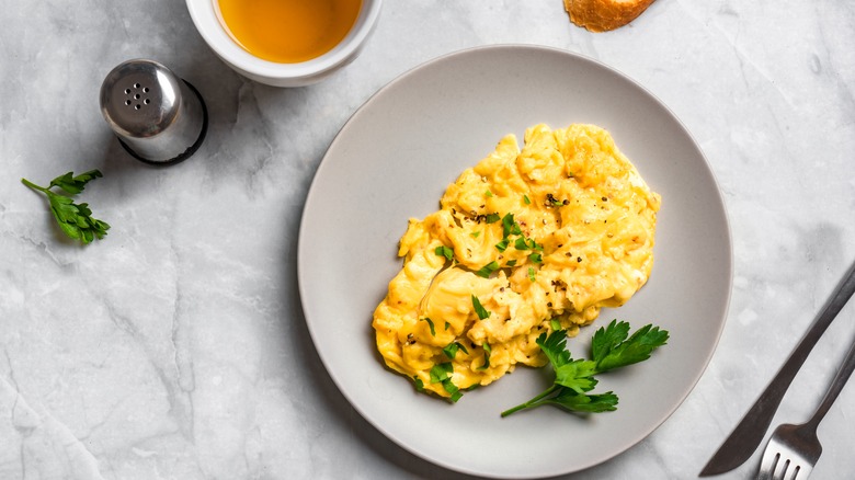 white plate of scrambled eggs