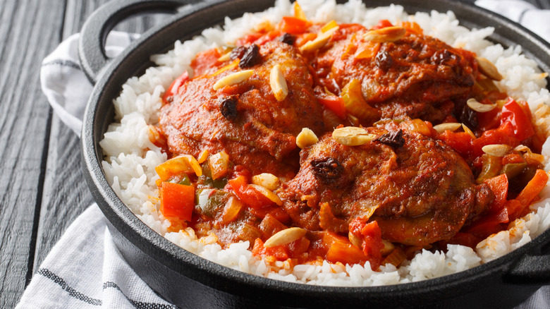 A cast-iron skillet full of country captain chicken.