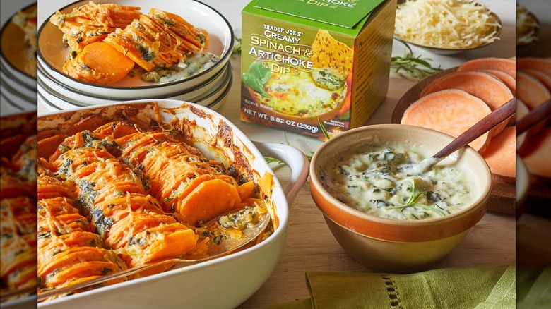 Trader Joe's Creamy Spinach and Artichoke Dip in a bowl next to a casserole
