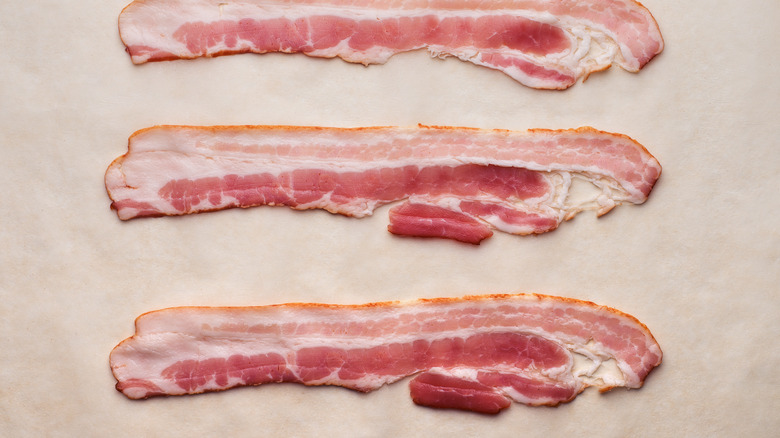 Raw bacon on parchment paper