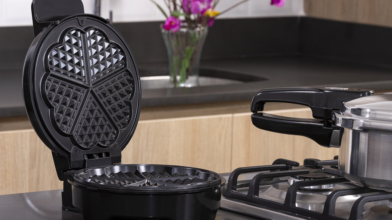 Waffle iron sitting on kitchen counter