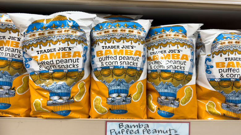 several bags of trader joe's bamba puffed peanut snacks lined up on a shelf