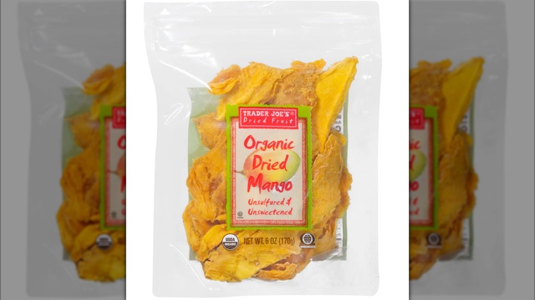 clear bag of Trader Joe's organic dried mango on white background