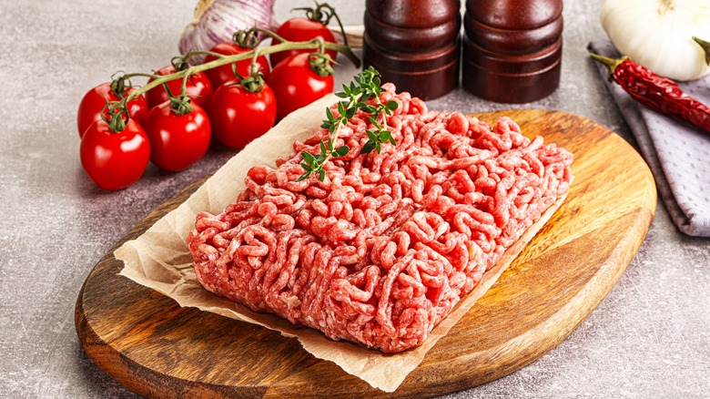 Raw groud meat with fresh tomatoes