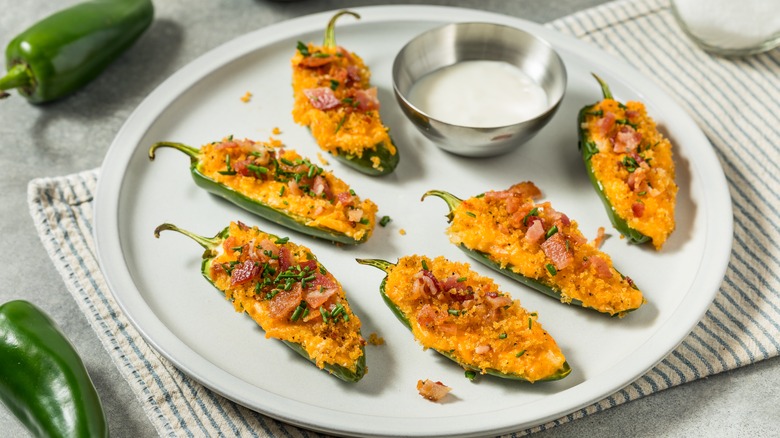 Hoemmade jalapeno poppers on plate with ramekin of ranch
