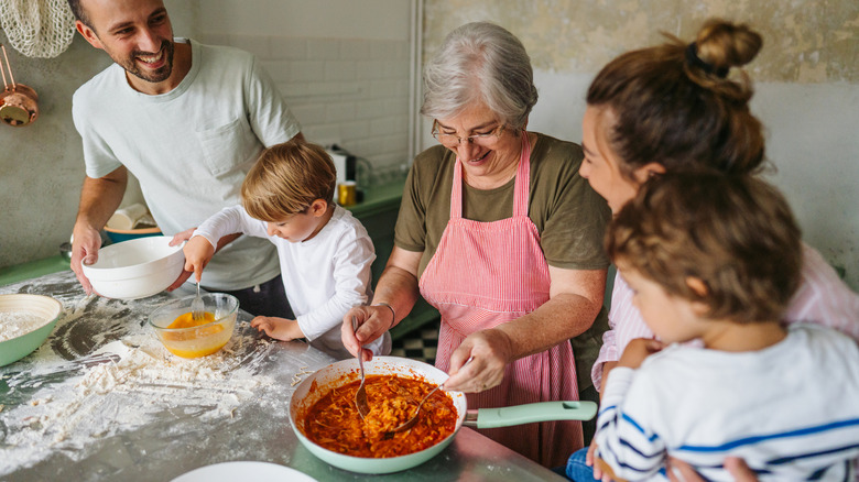 family making pasta together