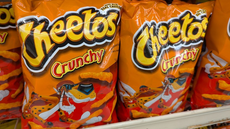 Bags of Cheetos stocked on a store shelf