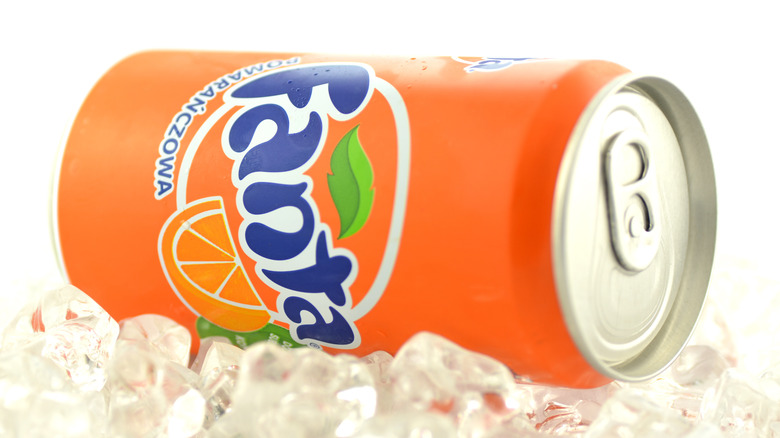 Fanta can on its side atop a bed of ice