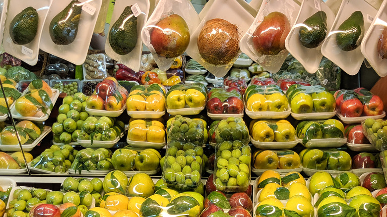Various types of produce tightly wrapped in plastic