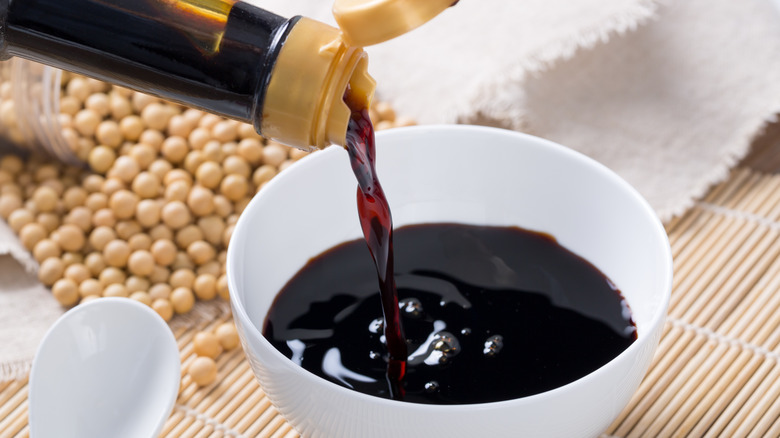 Pouring soy sauce into remaekin