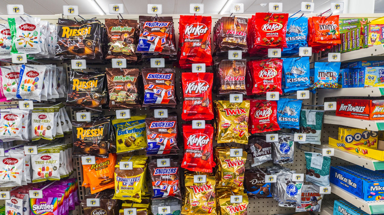 dollar tree shelf full of various types of bagged candy