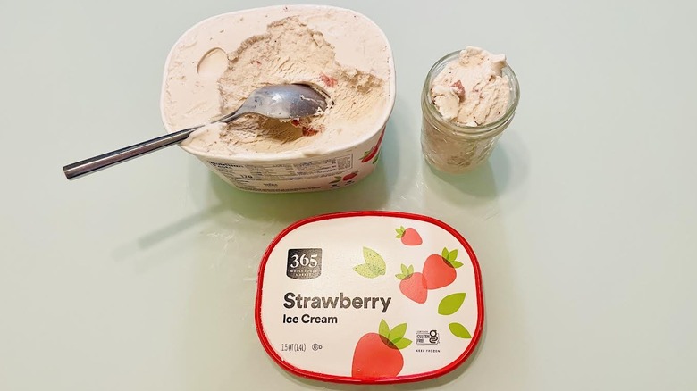 Overhead view of carton and cup full of 365 by Whole Foods Strawberry Ice Cream