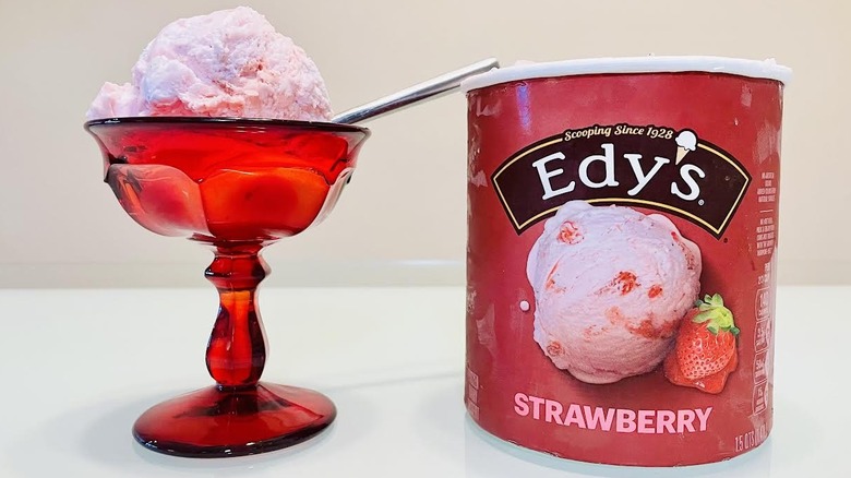 Red dish of Edy's Strawberry Ice Cream with carton alongside