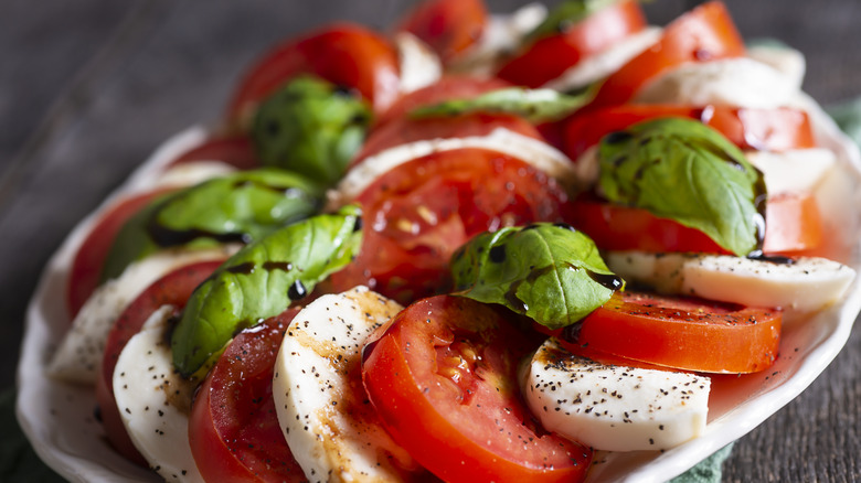 caprese salad on a white platter
