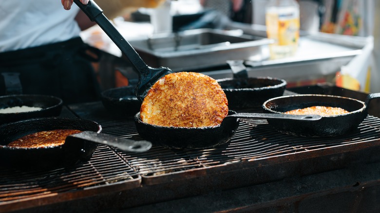 chef flipping a hash brown