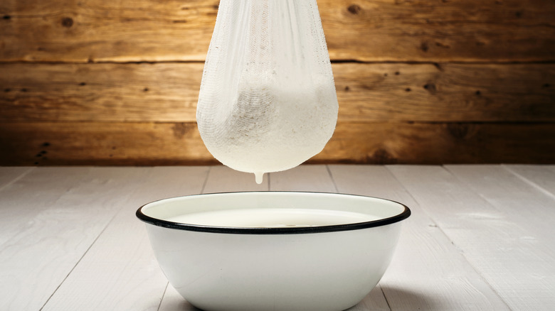 cheese cloth squeezing out moisture from potatoes