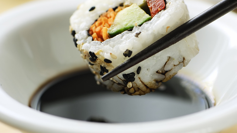 dipping sushi in soy sauce