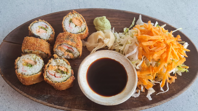 sushi with salad and soy sauce