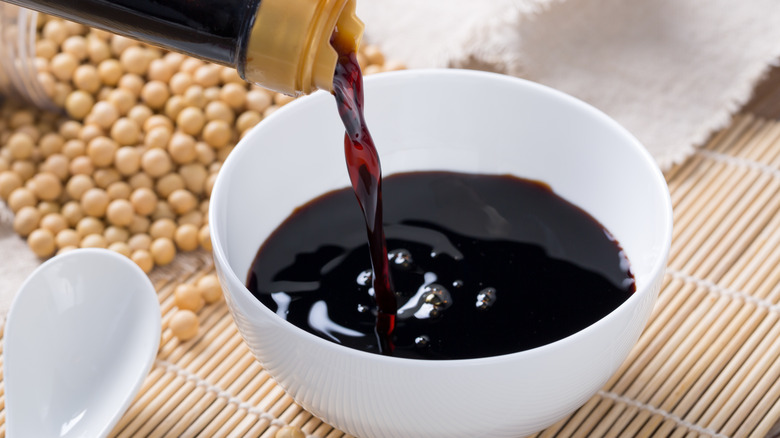 soy sauce poured from a bottle