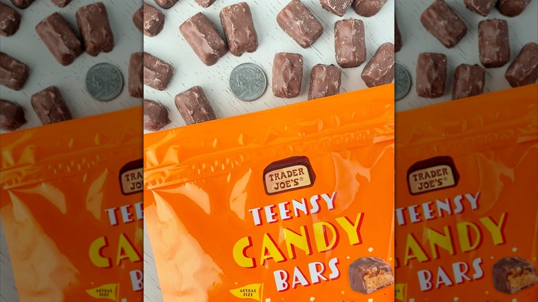 A package of Trader Joe's Teensy Candy Bars next to a quarter to show size