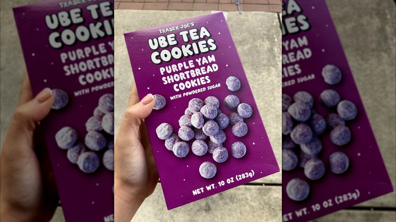 Someone holds a package of Trader Joe's Ube Tea Cookies
