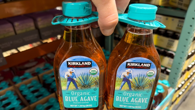 Two bottles of kirkland brand agave syrup