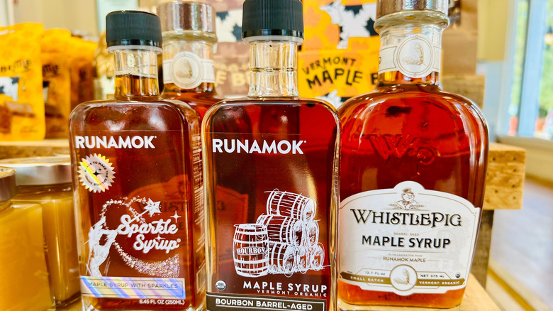 Three bottles of maple syrup on display