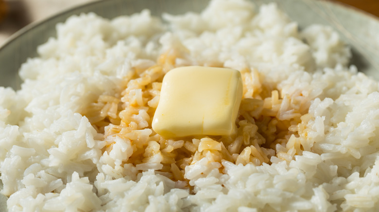 Bowl of white rice with soy sauce and a pat of butter on top